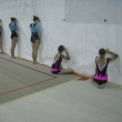 Gymnastky mohly sledovat sv� soupe�ky pouze skrze �kv�rky v plent� odd�luj�c� rozcvi�ovac� prostor od z�vodn� plochy, M�R spole�n�ch skladeb, Brno 27.11.